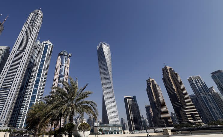 The Cayan tower, center — the world’s tallest twisted tower — at Dubai’s Marina on June 11, 2013, in the United Arab Emirates. (Photo: Karim Sahib/AFP/Getty Images)