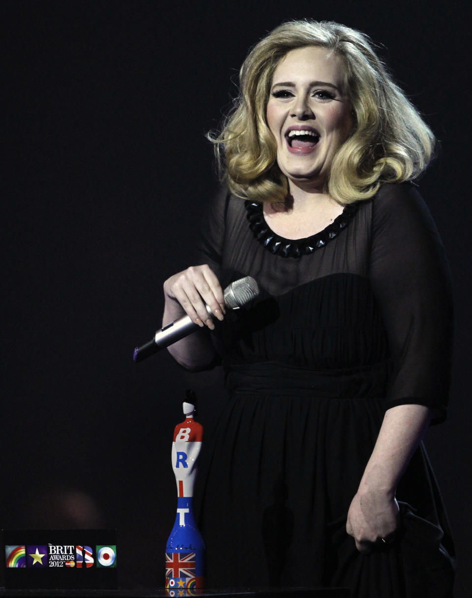 Adele reacts after winning the award for best British Female Solo Artist during the Brit Awards 2012 at the O2 Arena in London, Tuesday, Feb. 21, 2012. (AP Photo/Joel Ryan)