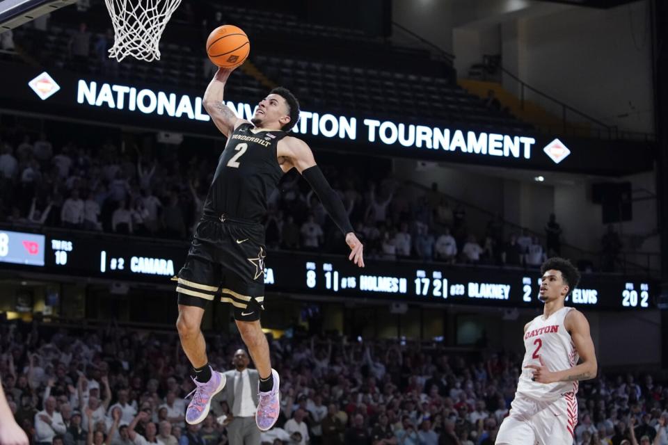 Vanderbilt's Scotty Pippen Jr. goes up for a dunk ahead of Dayton's Toumani Camara.