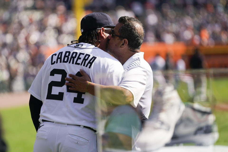 Detroit Tigers' Miguel Cabrera hugs his father during a celebration of his career before a baseball game against the Cleveland Guardians, Saturday, Sept. 30, 2023, in Detroit. (AP Photo/Paul Sancya)