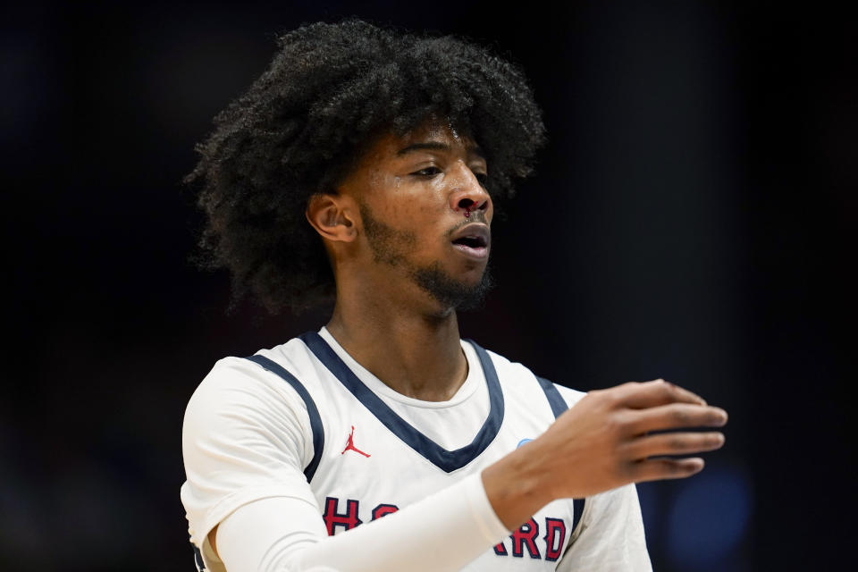 Howard's Isiah Warfield heads for treatment for a bloody nose during the first half of the team's First Four college basketball game against Wagner in the men's NCAA Tournament on Tuesday, March 19, 2024, in Dayton, Ohio. (AP Photo/Jeff Dean)