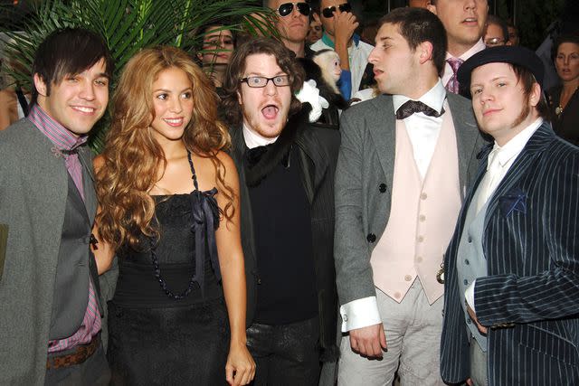 <p>Billy Farrell/Patrick McMullan via Getty </p> Fall Out Boy with Shakira at the 2006 MTV VMAs