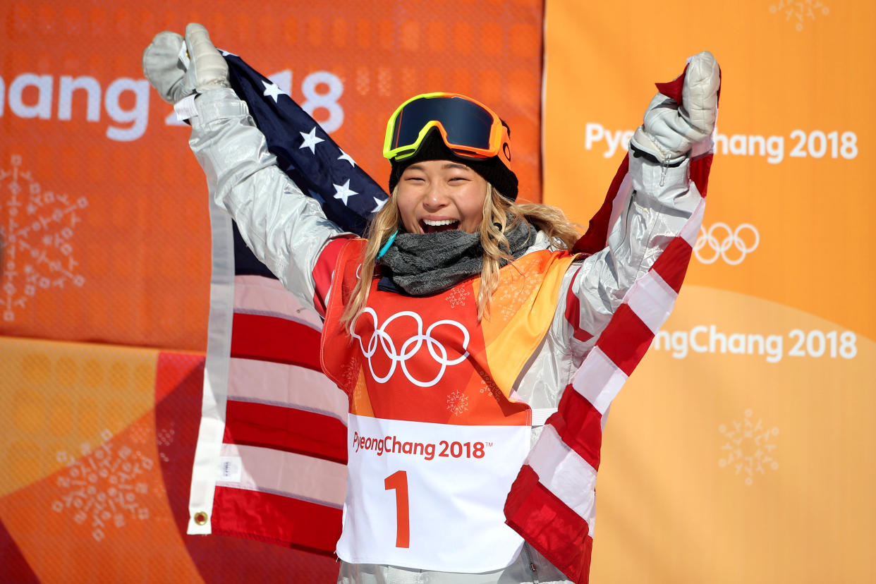 PYEONGCHANG, SOUTH KOREA – FEBRUARY 13: Gold medalist Chloe Kim #1 of the United States celebrates her gold medal win during the Snowboard – Ladies’ Halfpipe competition. (Getty Images)