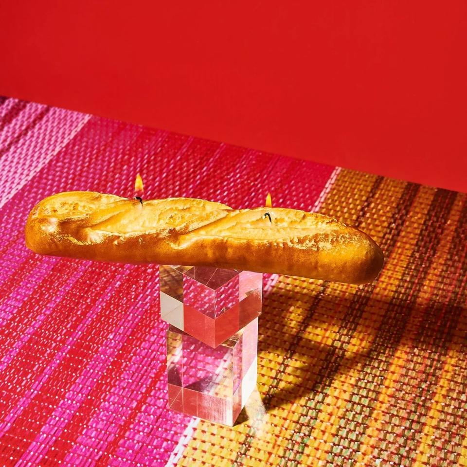 baguette shaped candle on top of crystal stand