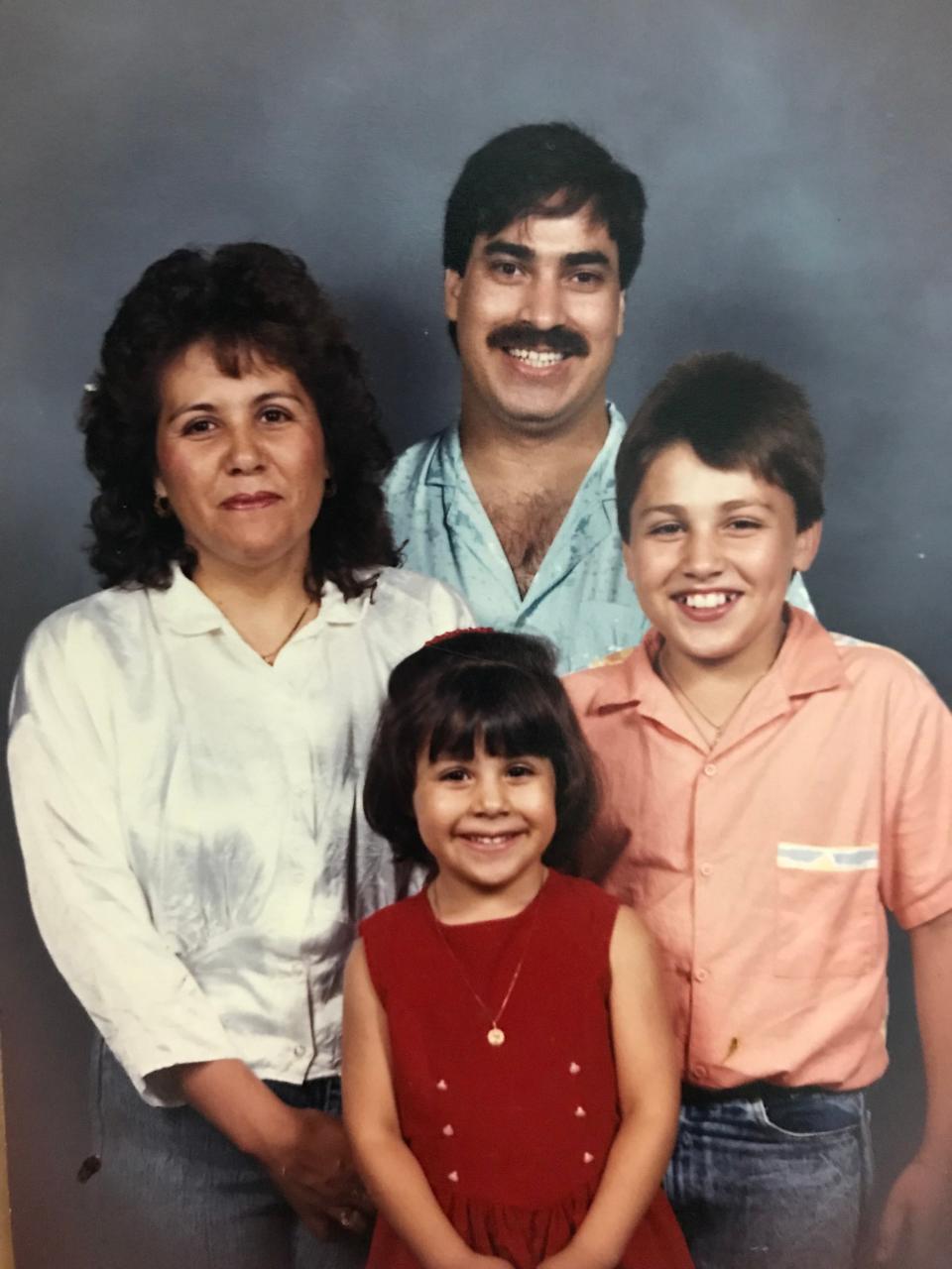 Erika L. Sánchez, her parents and brother.