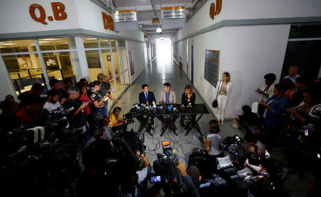 Rio de Janeiro's Police Chief for Internet crimes Alessandro Thiers (L), Civil Police Chief Fernando Veloso (C) and Police Chief for crimes against minors Cristiana Honorato attend a news conference on the investigations on the gang rape of a teenage girl after a video of the assault circulated widely on social media in Rio de Janeiro, Brazil, May 27, 2016. REUTERS/Ricardo Moraes