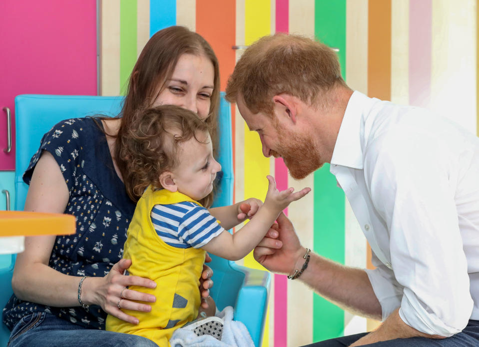 The Duke of Sussex plays with one year old Noah Nicholson during his visit to Sheffield Children's Hospital in Clarkson Street, Sheffield, where he officially opened the new wing.