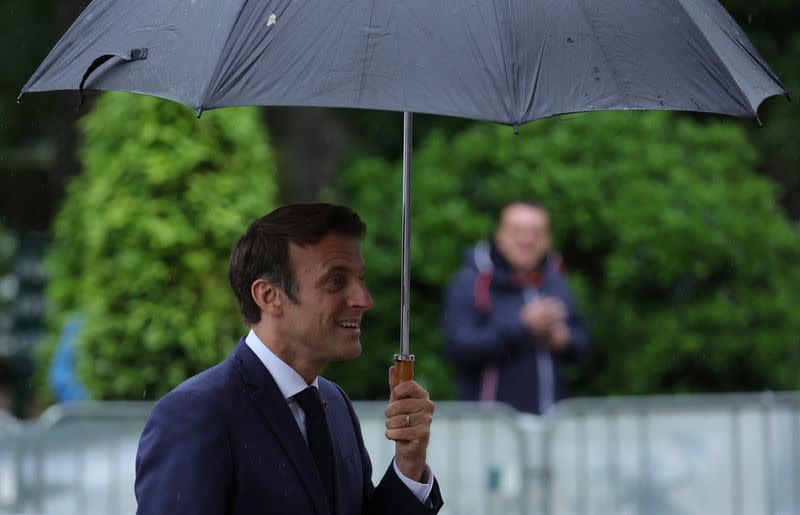 French President Macron votes in the second round of French parliamentary elections