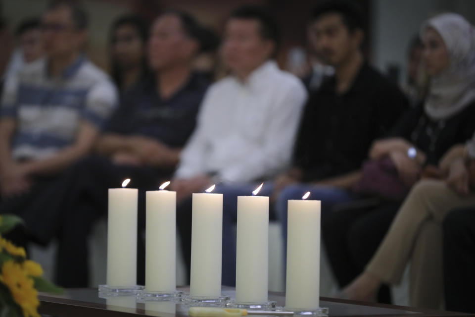 FILE - In this file photo dated Wednesday, July 17, 2019, Friends and family of victims from Malaysia Airlines Flight MH17 plane crash attend a ceremony marking the fifth anniversary of the tragedy, in Kuala Lumpur, Malaysia. An international team of investigators piecing together a criminal case in the July 2014 shooting down Malaysia Airlines Flight 17 over eastern Ukraine said Thursday Nov. 14, 2019, that evidence suggests links between Russia and rebels in the region were closer than previously believed.(AP Photo/Vincent Thian, FILE)