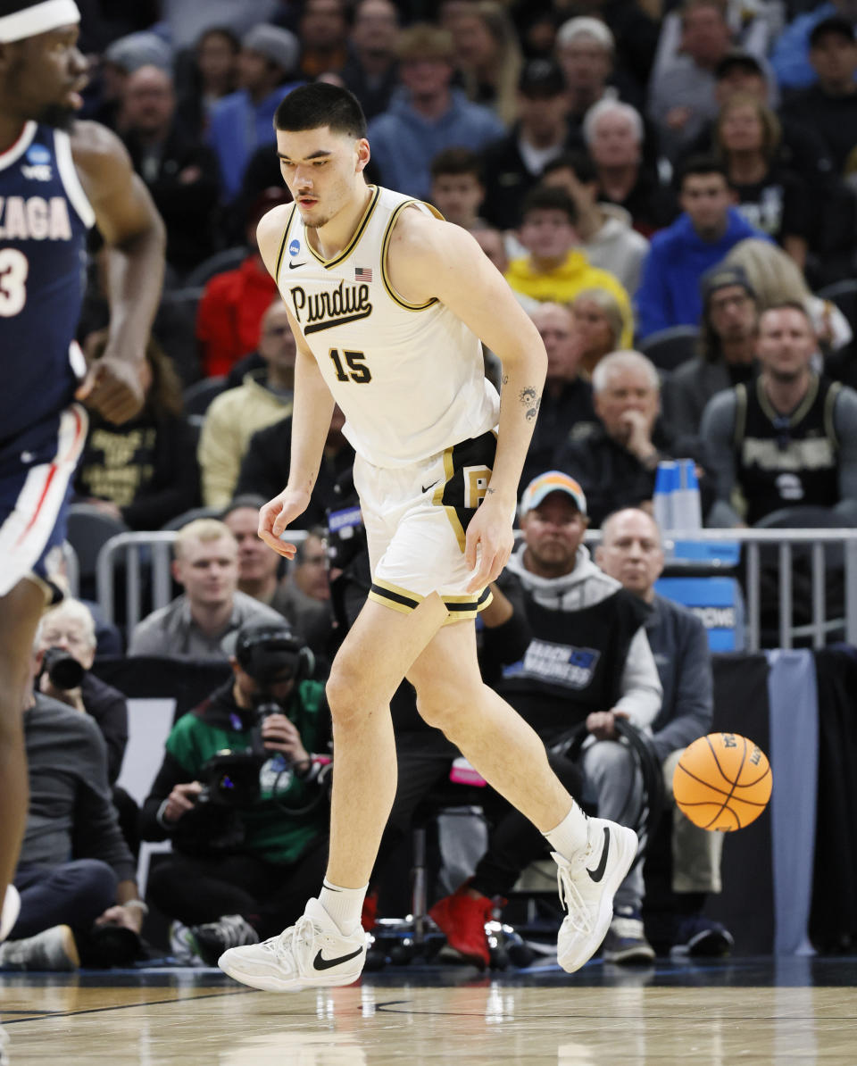 Purdue center Zach Edey runs back up court after a play during the first half of a Sweet 16 college basketball game against Gonzaga in the NCAA Tournament, Friday, March 29, 2024, in Detroit. (AP Photo/Duane Burleson)