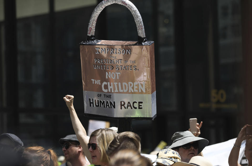 Thousands of people, including immigrants and their supporters, rally against President Trump's immigration policy, especially the detention of children, marching from Daley Plaza to the Chicago field office for Immigration and Customs Enforcement,, Saturday, July 13, 2019 in Chicago. (Abel Uribe/Chicago Tribune via AP)