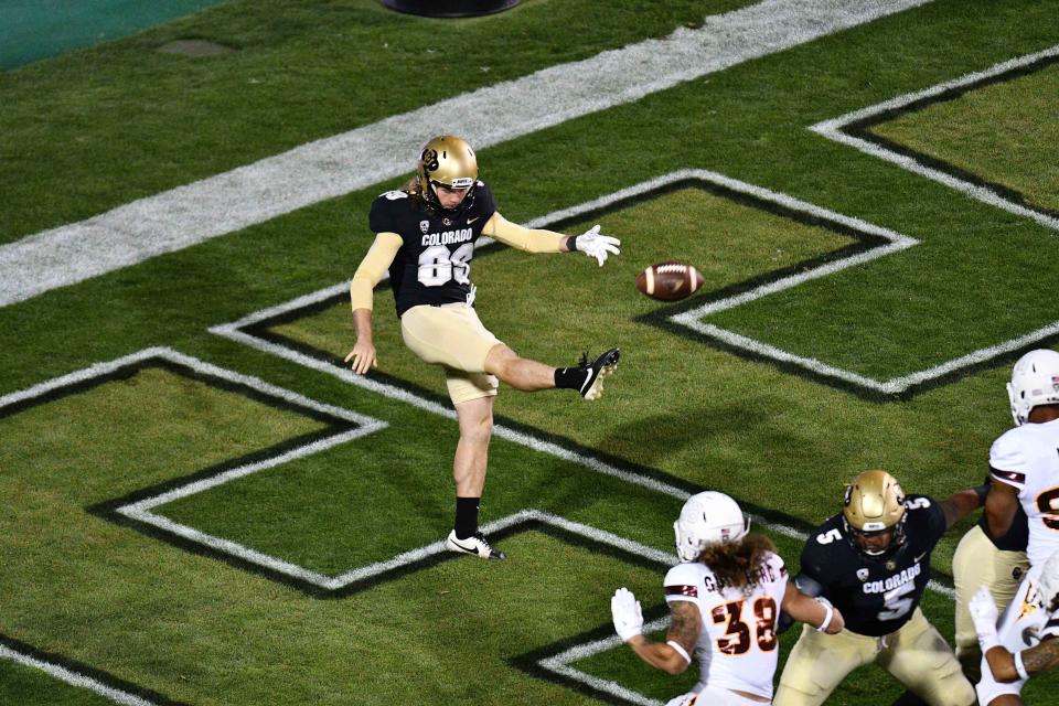 Colorado Buffaloes punter Alex Kinney (89) punts away from the end zone in the third quarter against the Arizona State Sun Devils at Folsom Field.