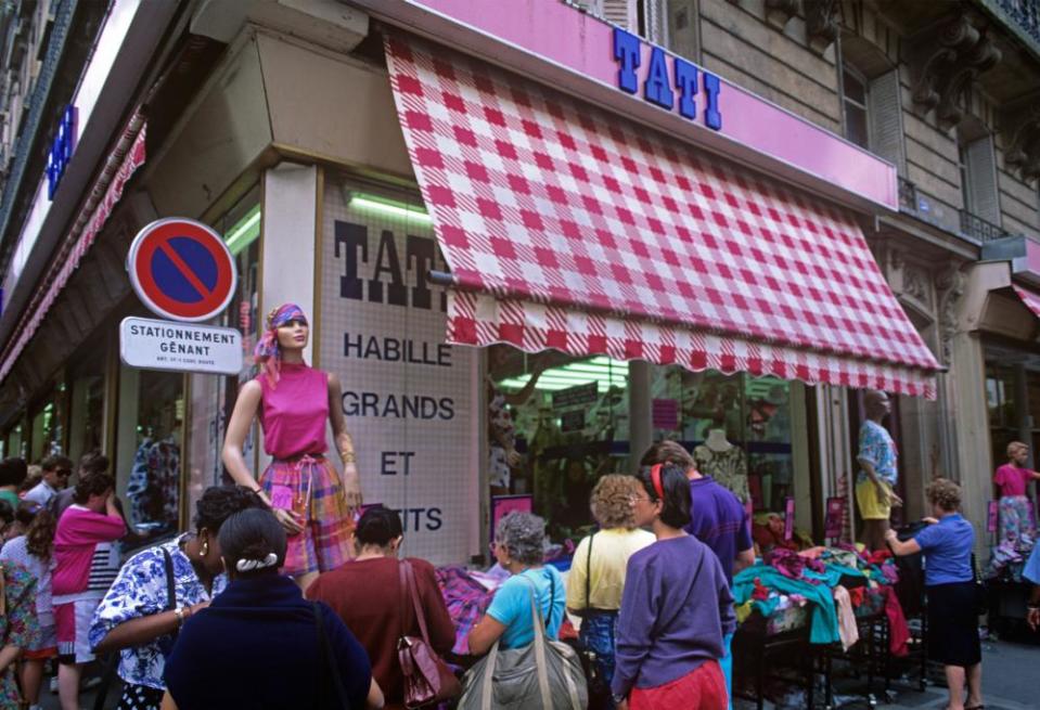 A Tati store selling cheap clothes on stalls in the streets of Montmartre, Paris, in 2005