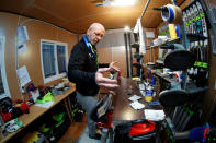 Heinz Haemmerle, or "Magic Heinzi" as US skier Lindsey Vonn calls her Austrian-born ski technician, checks the sharpness of the edges on a pair of skis of the world's most successful skiing women in his tiny waxing container at the Winter Olympics 2018 in Pyeongchang, South Korea February 19, 2018. Picture taken February 19, 2018. REUTERS/Leonhard Foeger