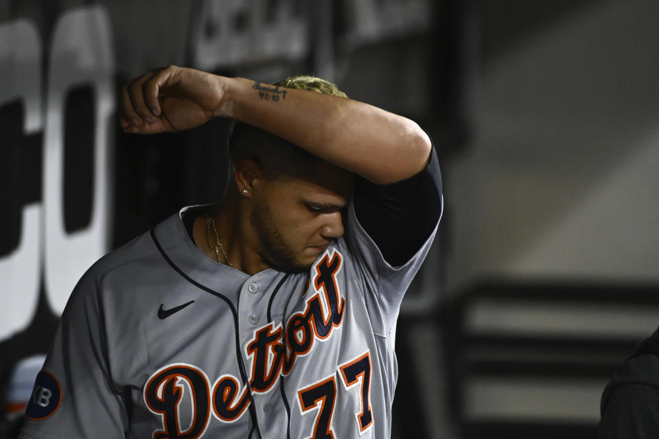 Detroit Tigers relief pitcher Joe Jimenez wipes his face in the dugout after being relieved after Chicago White Sox's Andrew Vaughn hit an RBI-single during the seventh inning of a baseball game, Saturday, Aug. 13, 2022, in Chicago. (AP Photo/Matt Marton)