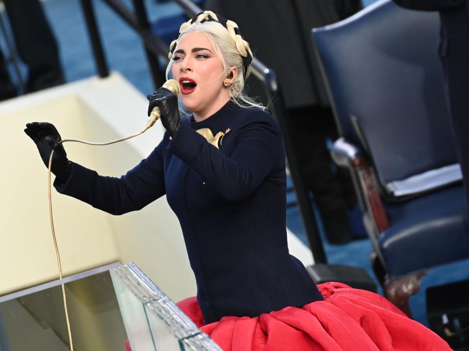 Lady Gaga sings the US National Anthem at the beginning of the swearing in ceremony of President Joe Biden on 20 January 2021, at the US Capitol in Washington, DC (SAUL LOEB/POOL/AFP via Getty Images)