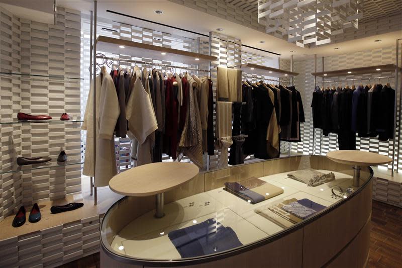 Shoes and clothes are displayed for sale in the shop of the young brand Shang Xia on its opening day in Paris September 11, 2013. REUTERS/Jacky Naegelen