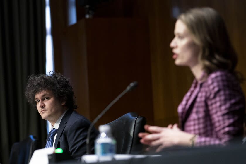 Sam Bankman-Fried, founder and chief executive officer of FTX Cryptocurrency Derivatives Exchange, left, during a Senate Agriculture, Nutrition and Forestry Committee hearing in Washington, D.C., U.S., on Wednesday, Feb. 9, 2022. The top Democrats and Republicans on the committee last month sent a letter to the CFTC calling for the regulator to take a more active role in overseeing cryptocurrencies. Photographer: Sarah Silbiger/Bloomberg via Getty Images