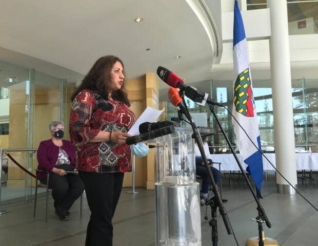 Dr. Kami Kandola, the N.W.T.'s chief medical officer of health, addresses reporters in the legislative assembly on Monday, following an announcement of a COVID-19 outbreak at Yellowknife's N.J. Macpherson School. 