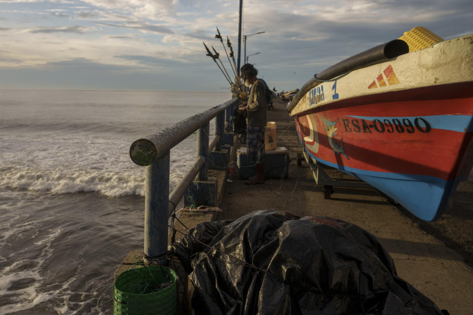 Boats sit on a dock after they were secured by fishermen preparing for the arrival of Hurricane Julia in La Libertad, El Salvador, Sunday, Oct. 9, 2022. Hurricane Julia hit Nicaragua’s central Caribbean coast on Sunday after lashing Colombia’s San Andres island, and a weakened storm was expected to emerge over the Pacific. (AP Photo/Moises Castillo)