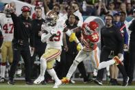 San Francisco 49ers' Deebo Samuel (19) runs in front of Kansas City Chiefs' Tyrann Mathieu (32) during the first half of the NFL Super Bowl 54 football game Sunday, Feb. 2, 2020, in Miami Gardens, Fla. (AP Photo/Wilfredo Lee)