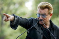 Irish singer Bono speaks to the guests before the unveiling of a tapestry honoring John Lennon at Ellis Island in New York July 29, 2015. REUTERS/Eduardo Munoz