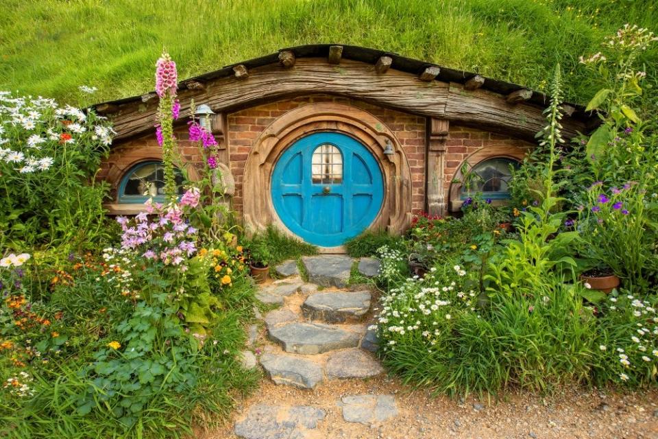 A Hobbit hole with a blue door on the Hobbit movie set in New Zealand