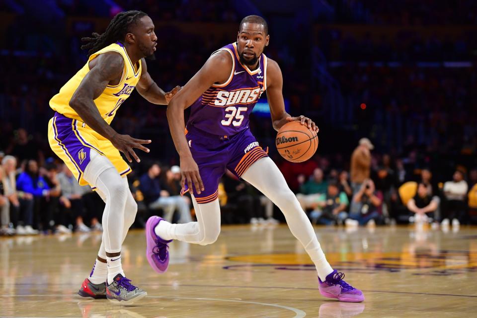Phoenix Suns forward Kevin Durant (35) moves the ball ahead of Los Angeles Lakers forward Taurean Prince (12) during the first half at Crypto.com Arena on Oct. 26, 2023.