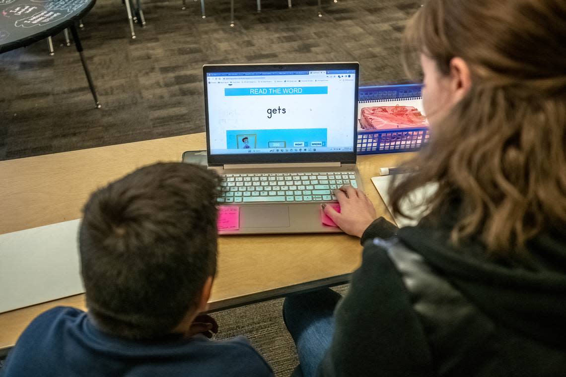 Read On! tutor, Jessica Seibold, works with fifth grader Yousuf Ghafari on his reading exercise at F.C. Joyce Elementary School during his tutoring session earlier this month. Scott Lorenzo/Special to the Bee