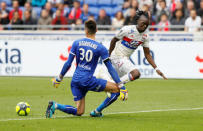 Soccer Football - Ligue 1 - Olympique Lyonnais v FC Nantes - Groupama Stadium, Lyon, France - April 28, 2018 Lyon's Bertrand Traore in action with Nantes' Ciprian Tatarusanu REUTERS/Emmanuel Foudrot