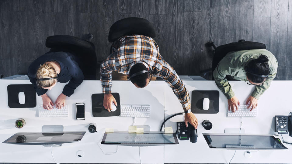 High angle shot of a group of call centre agents working in an office.