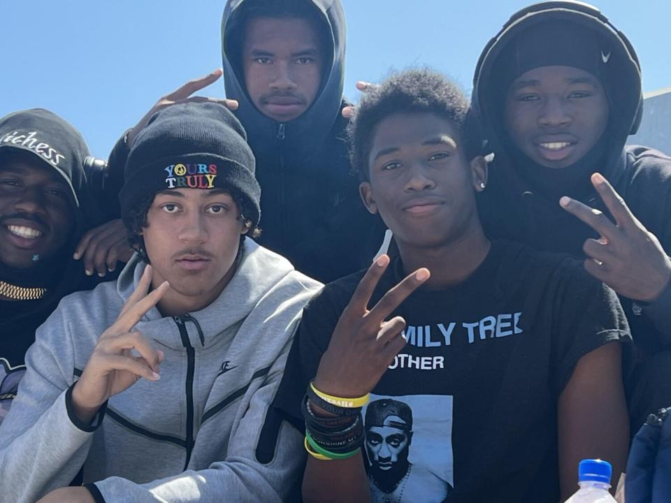 Nathan Santa Cruz (second from right) is surrounded by his Venice football and track teammates