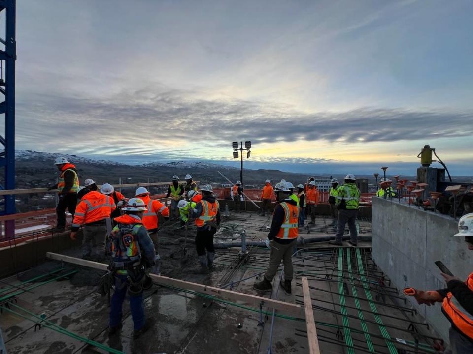 Laborers on the Arthur work on the roof on Feb. 5 as they finish vertical construction.