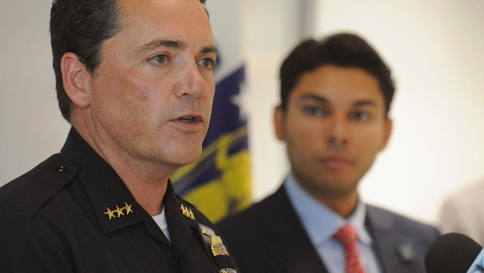 Former Police Chief Albert Dupere speaks at a press conference with former mayor Jasiel Correia II, in the background.