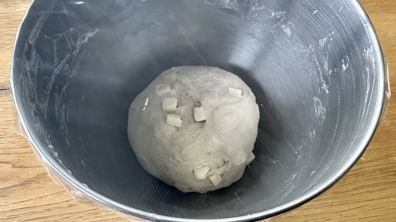 Asiago bagel dough rising in bowl