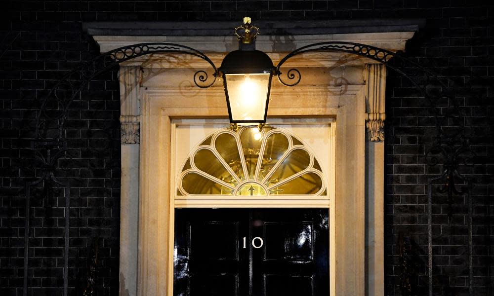 A light shines above the door of No 10 during yesterday’s cabinet meeting.