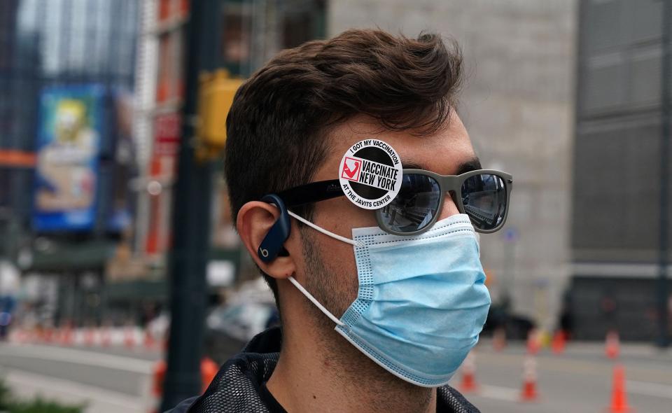 A man leaves after receiving his vaccine at the Javits Center Covid-19 vaccination center on April 13, 2021 in New York.