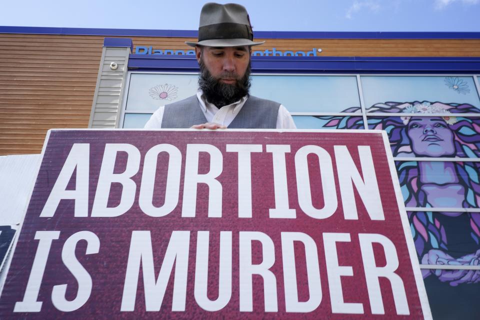 John Olkowski protests outside Planned Parenthood, Monday, Sept. 18, 2023, in Milwaukee. (AP Photo/Morry Gash)