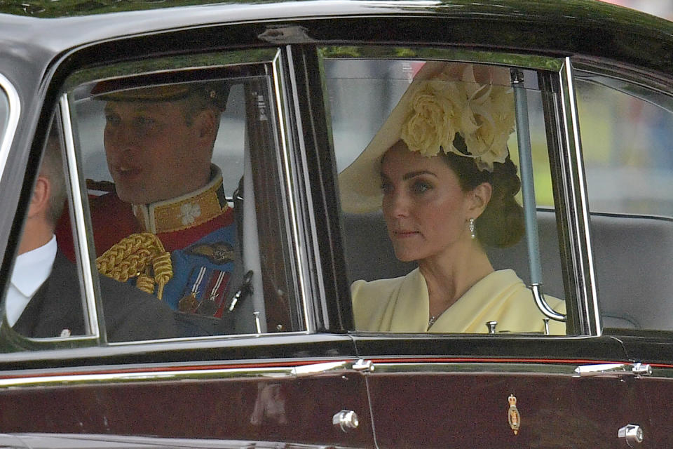 Britain's Prince William, Duke of Cambridge, (L) and Britain's Catherine, Duchess of Cambridge (R) are driven to Buckingham Palace ahead of the Queen's Birthday Parade, 'Trooping the Colour', in London on June 8, 2019. - The ceremony of Trooping the Colour is believed to have first been performed during the reign of King Charles II. Since 1748, the Trooping of the Colour has marked the official birthday of the British Sovereign. Over 1400 parading soldiers, almost 300 horses and 400 musicians take part in the event. (Photo by Daniel LEAL-OLIVAS / AFP)        (Photo credit should read DANIEL LEAL-OLIVAS/AFP/Getty Images)