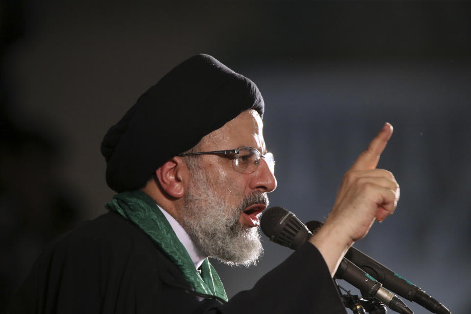 FILE - In this May 16, 2017 file photo, hard-line cleric Ebrahim Raisi speaks during a 2017 presidential election rally in Tehran, Iran. On Thursday March 7, 2019, Iran's Supreme Leader Ayatollah Ali Khamenei named Raisi as the country's new judiciary chief. That’s sparked concern from rights activists over his involvement in the execution of thousands in the 1980s. Raisi’s selection comes after he was trounced by incumbent Hassan Rouhani in the country’s 2017 presidential election. (AP Photo/Vahid Salemi, File)