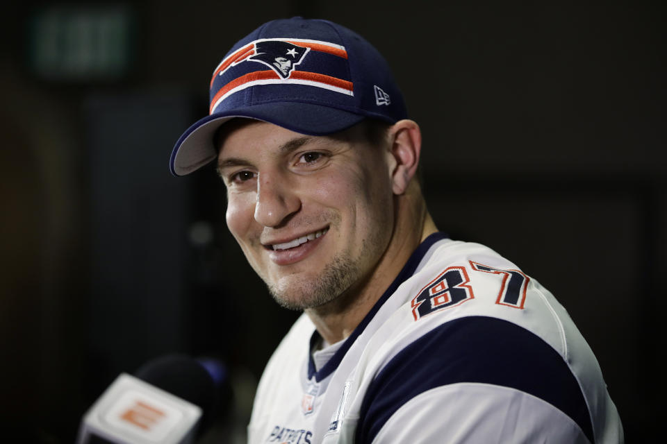 FILE - In this Jan. 30, 2019, file photo, New England Patriots' Rob Gronkowski speaks with members of the media during a news conference ahead of the NFL Super Bowl 53 football game in Atlanta. Gronkowski will be in Miami for the Super Bowl. He will not be preparing for kickoff with Tom Brady and the rest of his old New England teammates. Instead, the man who retired from the Patriots and the NFL in March will be hosting his first Super Bowl party. (AP Photo/Matt Rourke, File)
