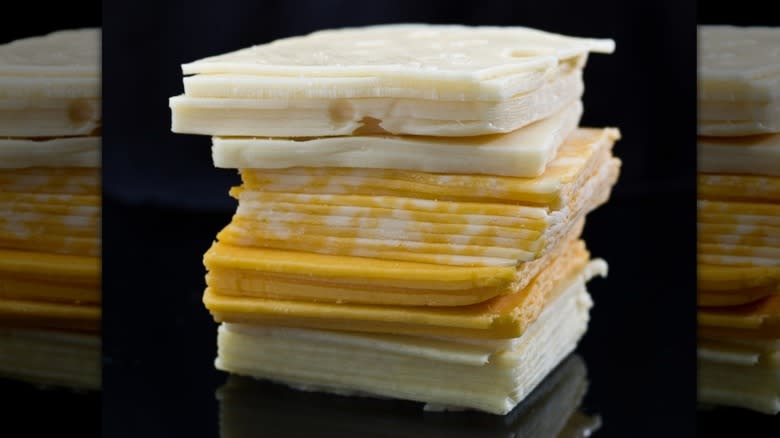 Stack of sliced cheeses