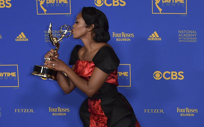 Mishael Morgan poses in the press room with the award for outstanding performance by a lead actress in a drama series for her role in "The Young and the Restless" at the 49th annual Daytime Emmy Awards on Friday, June 24, 2022, in Pasadena, Calif. (Photo by Jordan Strauss/Invision/AP)