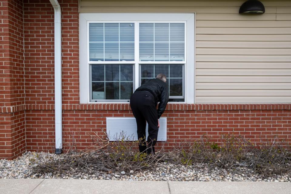 Duane Zenn visits his mother, Mary Ellen Zenn, during a nursing home window visit Friday, April 23, 2021, at Prairie Lakes Health Campus in Noblesville, Ind. Zenn says the window visit is due to a COVID-19 case inside the nursing home but should be able to visit his mother in person in four days. Mary Ellen was a resident at another nursing home earlier this year, Miller's Senior Living Community in Castleton, when a bedsore on her heel sent her to the hospital. The sore was so badly infected that gangrene had set in, and her right leg had to be amputated above the knee.