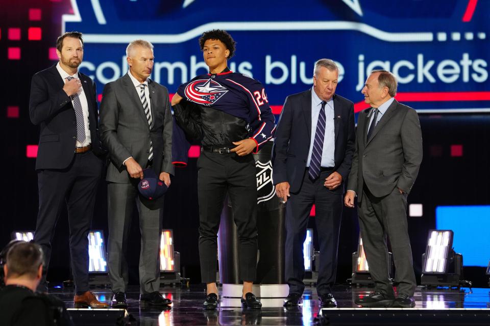 The Blue Jackets bring forward Cayden Lindstrom on stage after taking him with the 4th overall pick in the 2024 NHL draft.