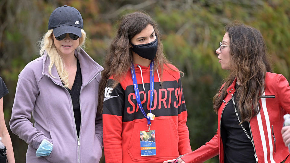 Tiger Woods' ex-wife, daughter and girlfriend are all seen here chatting together.