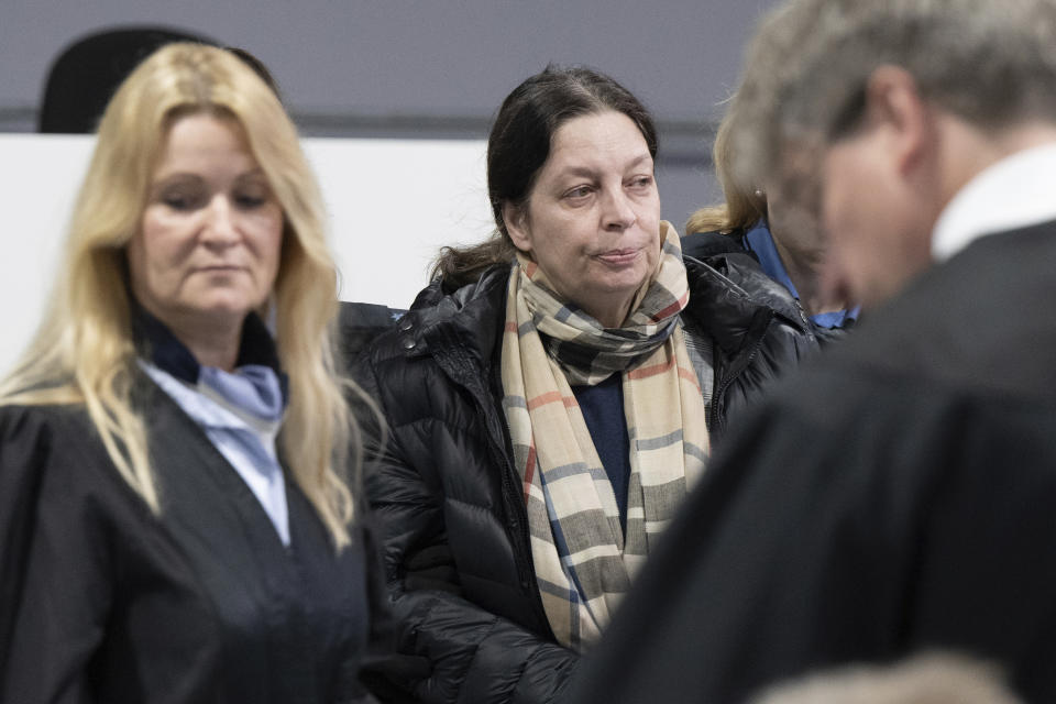 Defendant Birgit Malsack-Winkemann, center, sits at the start of a trial against the alleged leaders of a suspected German far-right coup plot, in the Sossenheim branch of the Frankfurt Higher Regional Court, in Frankfurt, Germany, Tuesday, May 21, 2024. The alleged leaders of a suspected far-right plot to topple the German government went on trial on Tuesday, opening the most prominent proceedings in a case that shocked the country in late 2022. Nine defendants faced judges at a special warehouse-like courthouse built on the outskirts of Frankfurt to accommodate the large number of defendants, lawyers and media dealing with the case. (Boris Roessler/Pool Photo via AP)