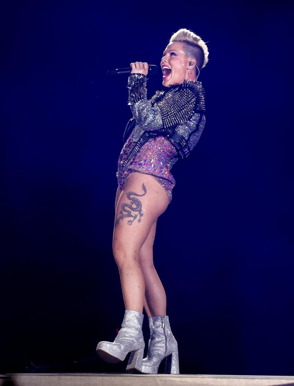 A female singer performs onstage