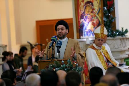 Ammar al-Hakim, head of the Hikma movement, speaks during a mass on Christmas at St George Chaldean Catholic Church in Baghdad, Iraq December 25, 2018. REUTERS/Thaier Al-Sudani