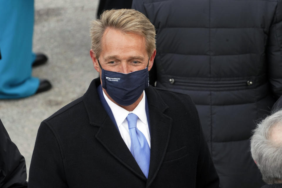 FILE - In this Jan. 20, 2021, file photo, former Arizona Sen. Jeff Flake arrives for the inauguration of President-elect Joe Biden during the 59th Presidential Inauguration at the U.S. Capitol in Washington. The Arizona Republican Party is confronting its future this weekend after losing a second Senate seat and the presidential race. On the agenda for the state committee meeting Saturday: the reelection bid by its controversial chairwoman, who has been among the most prolific promoters of baseless election conspiracies, and the censure of some of the party's best-known figures: Cindy McCain, former Sen. Jeff Flake and Gov. Doug Ducey. (AP Photo/Andrew Harnik, File)